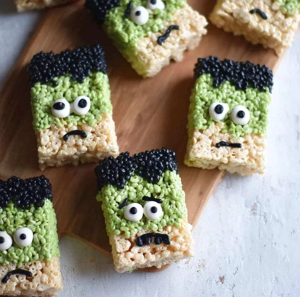 Halloween-themed Frankenstein Rice Krispie Treats decorated with green frosting