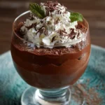 Delicious Irish Cream Chocolate Mousse dessert topped with cocoa and cream.