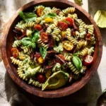 Delicious BLT Pasta Salad with bacon, lettuce, and tomatoes served in a bowl.