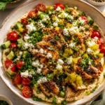 Grilled marinated chicken with a fresh tomato and cucumber salad