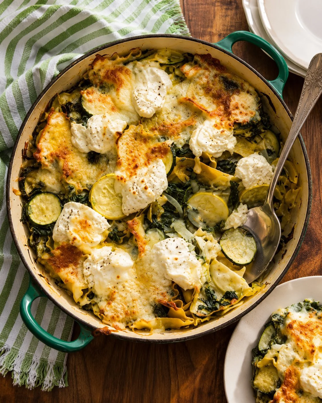No-Boil Lasagna Bake with Summer Squash and Spinach topped with herbs